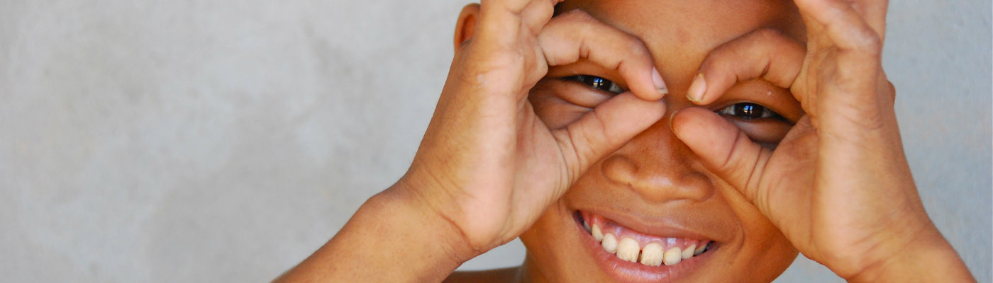 Header: Smiling Khmer boy